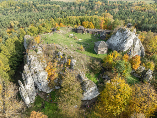 Aerial drone view of stronghold on Birow Hill. Reconstructed stronghold on Birow Hill in the Czestochowa Upland in the village of Podzamcze,Ogrodzieniec, Poland. Limestone rock hill in autumn. photo