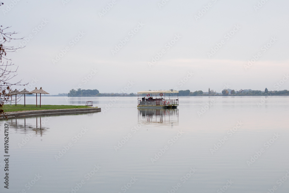 A tranquil lake scene with a floating dock and overcast sky evokes serenity and peaceful solitude, ideal for reflecting nature's calmness A tranquil lake scene with a floating dock and overcast sky evokes serenity and peaceful solitude, ideal for reflecting nature's calmness