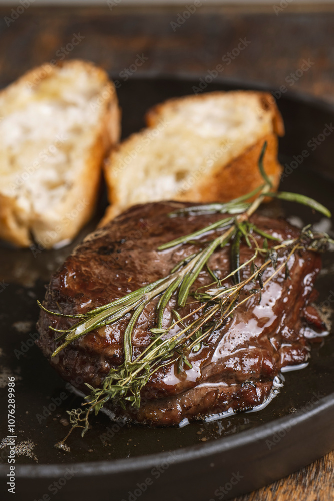 Grilled beef steak with rosemary and toasted baguette Grilled beef steak with rosemary and toasted baguette