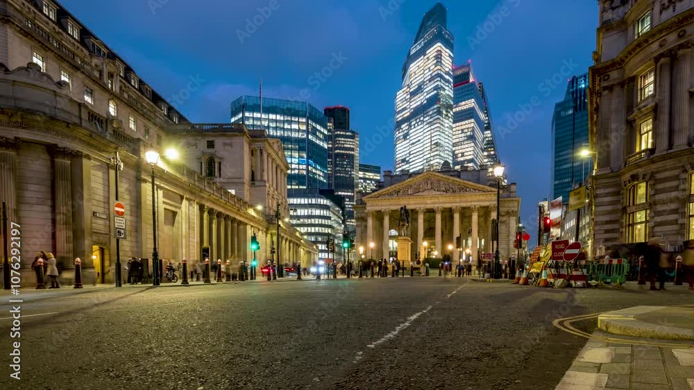 Evening time lapse view of the City of London with modern office skyscrapers and the Bank of England in front