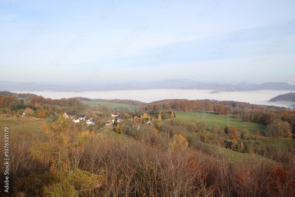 view of the inversion in the valley. only the tops of the hills are visible.