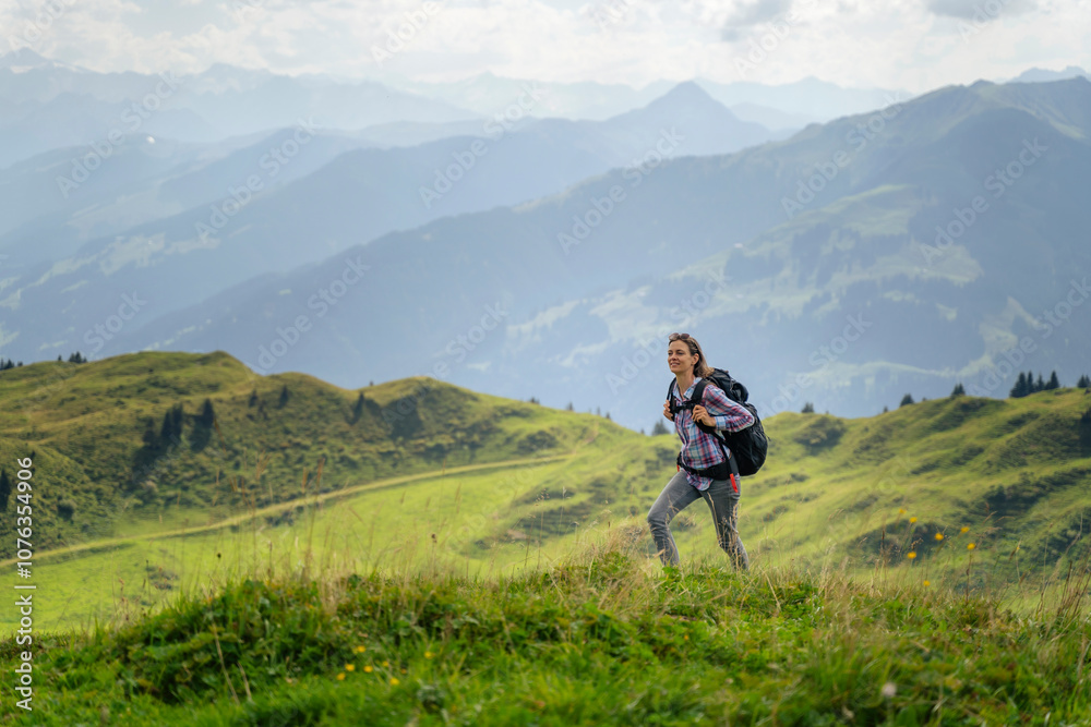Mature woman hiking on mountain at weekend Mature woman hiking on mountain at weekend