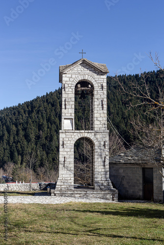 View of the bell tower (Trikala Province, Greece) on a sunny winter day photo