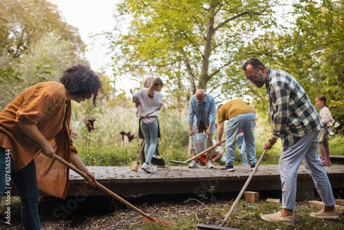 Volunteers helping at community cleanup at the local park photo
