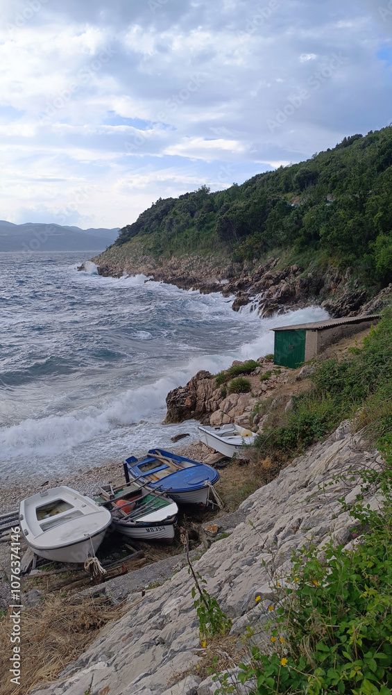 boats on a stormy beach