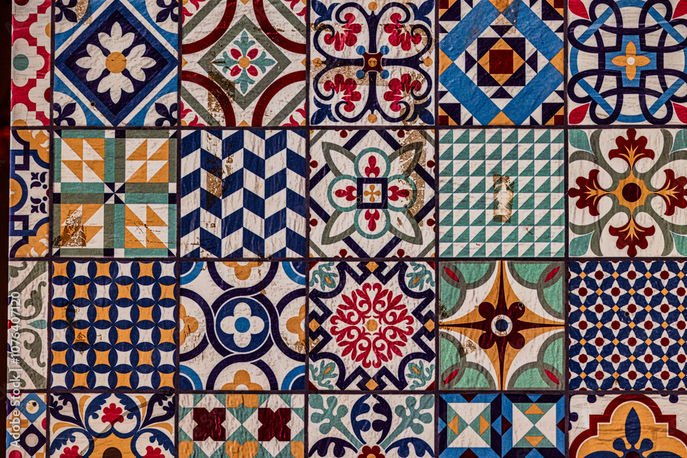 retro  of decorative ceramic tiles displays an array of intricate patterns and vibrant colors, including blues, reds, and greens
