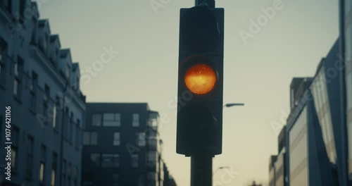 Wallpaper Mural Low light cinematic shot of traffic light for cars changing light from green to yellow to red. Torontodigital.ca