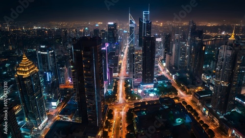 Aerial view of a vibrant city at night, with illuminated skyscrapers and streets forming a web of light, capturing urban energy.