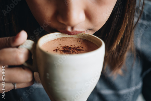 a woman drink hot cacao
