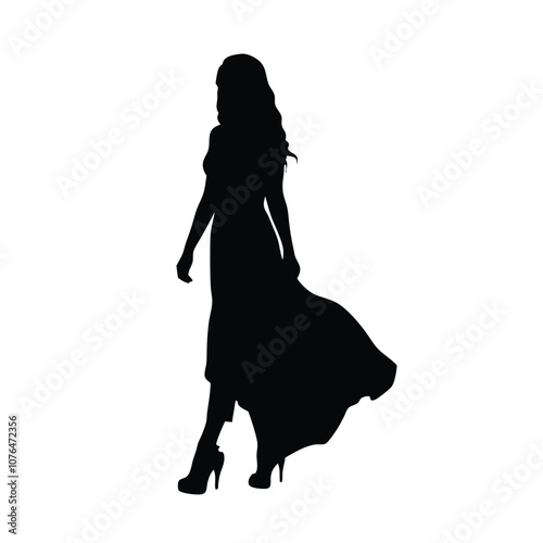 A woman in a long dress is walking on a white background. She is wearing high heels