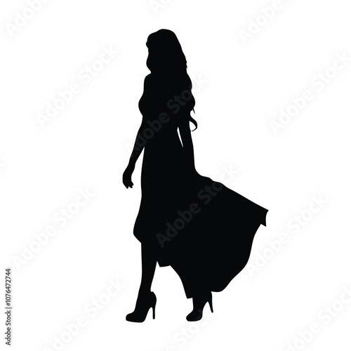 A woman in a long dress is walking on a white background. She is wearing high heels