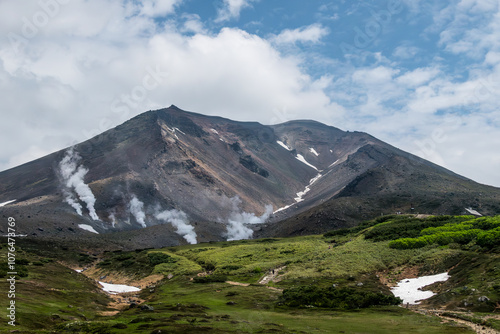 The volcano Mount Asahidake with smoking fumaroles in Daisetsuzan National Park ,Hokkaido, Japan photo