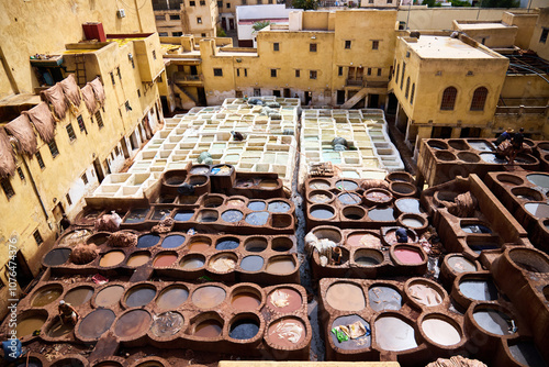 People works in the Shuara leather dyeing factory. Traditional Moroccan craft. photo