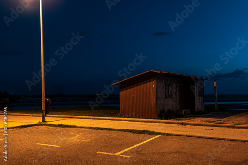 Illuminated beach shed at night conil de la frontera, andalusia, spain photo