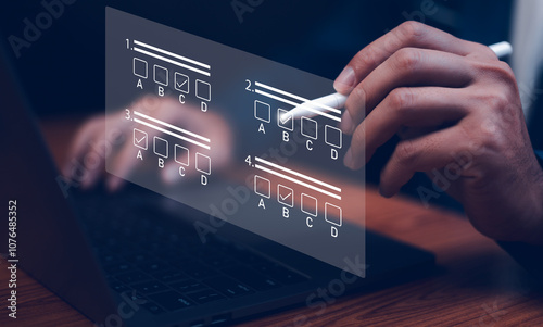Obraz na płótnie Businessman using laptop filling online survey exam Choosing the right answer in the exam, filling out an online survey form. Online test or exam, pass exam on internet, choose correct answer w salonie