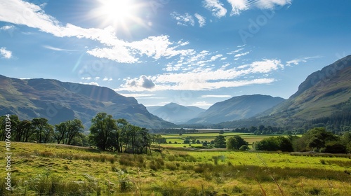 Gorgeous sunny day landscape featuring vast green fields stretching as far as the eye can see, with colorful wildflowers dotting the meadows. The bright blue sky is dotted with fluffy white clouds,