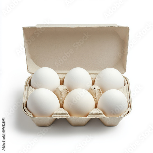 Fresh white eggs in cardboard carton, neatly arranged in pack of six. simplicity and purity of eggs evoke sense of natural goodness and culinary potential photo