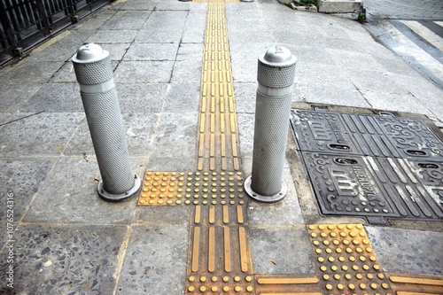 The braille blocks in yellow at the pedestrian area are intended to help blind people walk