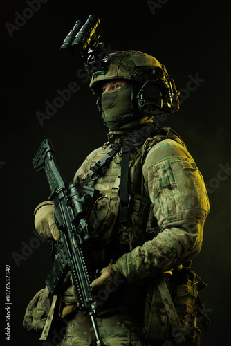 Portrait of Soldier in Tactical Gear with Night Vision Goggles and Rifle