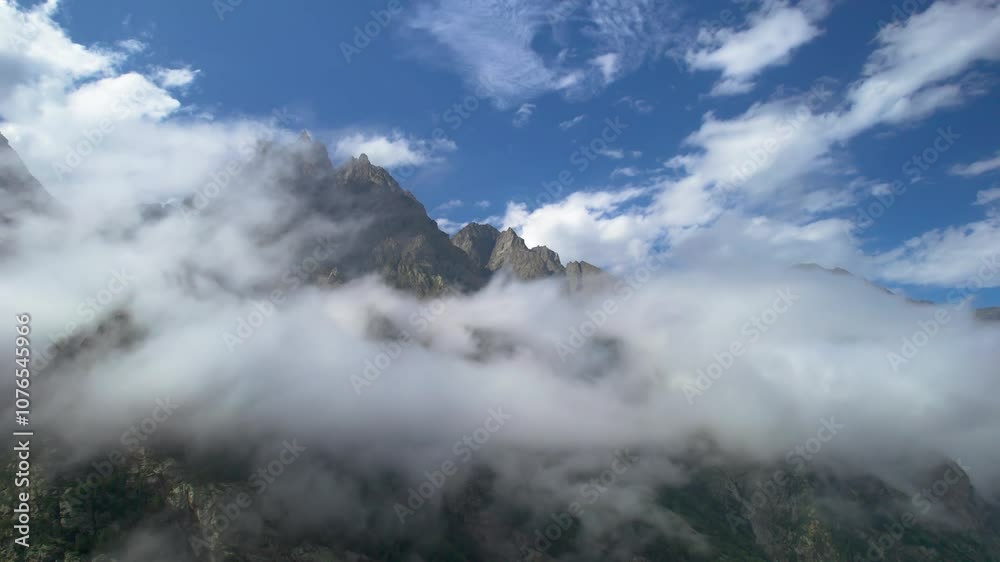 High mountains above the clouds, low clouds in the North Caucasus mountains High mountains above the clouds, low clouds in the North Caucasus mountains