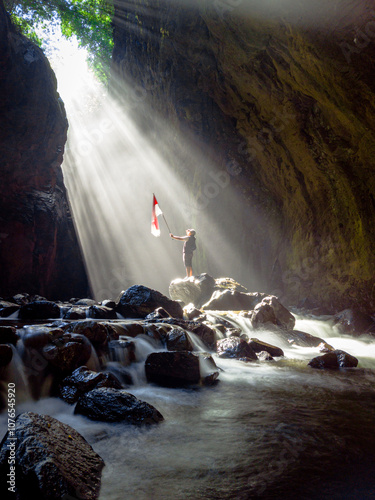 a young man's struggle to raise the flag after going through difficult obstacles. photo