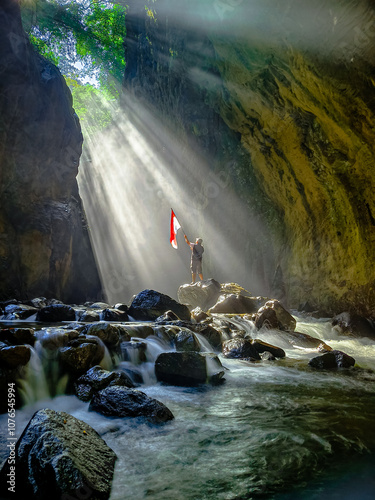 a young man's struggle to raise the flag after going through difficult obstacles. photo