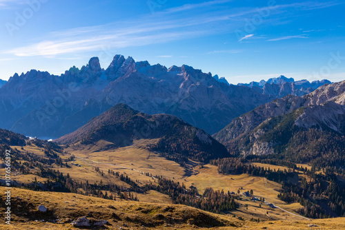 Autumn colors in the mountains. Yellow and orange forest tree in the Dolomites, autumn in the Alps beautiful colorful landscape