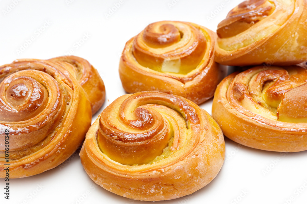 White white with sweets and buns. food snack bun concept. a large round bun with a small twig and brown and white . a round bun with sweets and brown frosting on a lifestyle white. White white with sweets and buns. food snack bun concept. a large round bun with a small twig and brown and white . a round bun with sweets and brown frosting on a lifestyle white.
