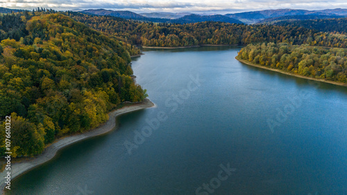 Fototapeta Naklejka Na Ścianę i Meble -  Autumn Serenity: Aerial View of Solina Lake and Bieszczady's Fall Landscape