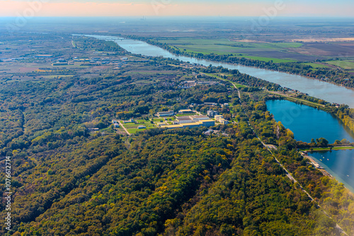Aerial view of valley with farm fields, pond and Danube river. High quality photo