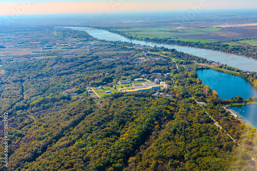 Aerial view of valley with farm fields, pond and Danube river. High quality photo