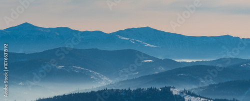 Velky Krivan and Maly Krivan in Mala Fatra in Slovakia with lower hills on the frontside from Barania Gora hill in Beskid Slaski mountains in Poland photo