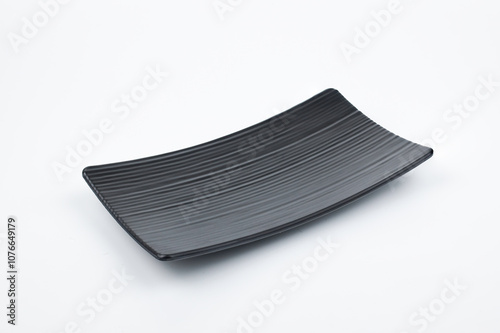 Empty black Japanese Ceramic square plate isolated on a white background