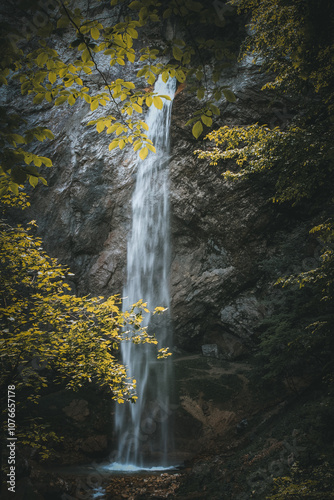 Mountains in Austria, Waterfall, Autumn, moody green, moody orange, blue sky, mystical, holiday