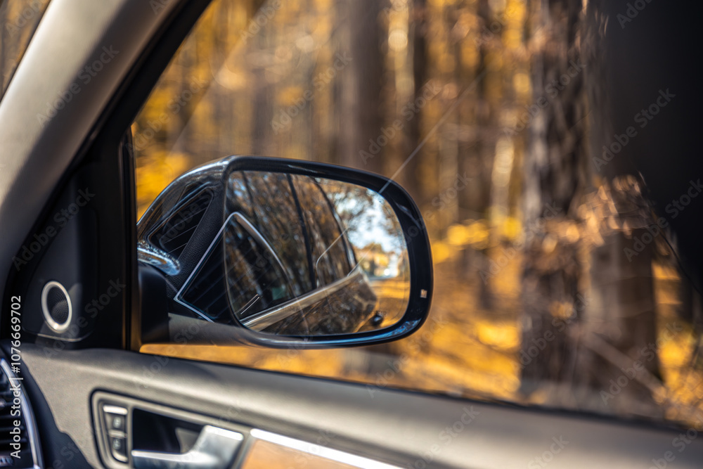 Rear view side mirror of a car. Seen through the rear view mirror. Rear view side mirror of a car. Seen through the rear view mirror.