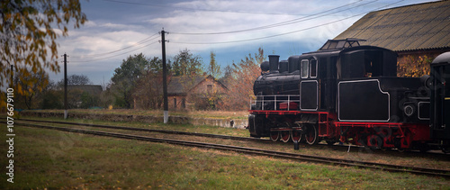 Narrow-gauge railway.Tourist, ancient steam locomotive undergoing maintenance.Pre-revolutionary steam locomotive. photo