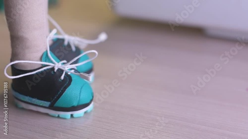 close-up demonstration of doll shoes