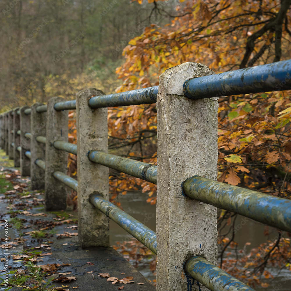 CLASSICAL BRIDGE AND AUTUMN - A very old object over the Parseta River with a colorful forest in the background CLASSICAL BRIDGE AND AUTUMN - A very old object over the Parseta River with a colorful forest in the background