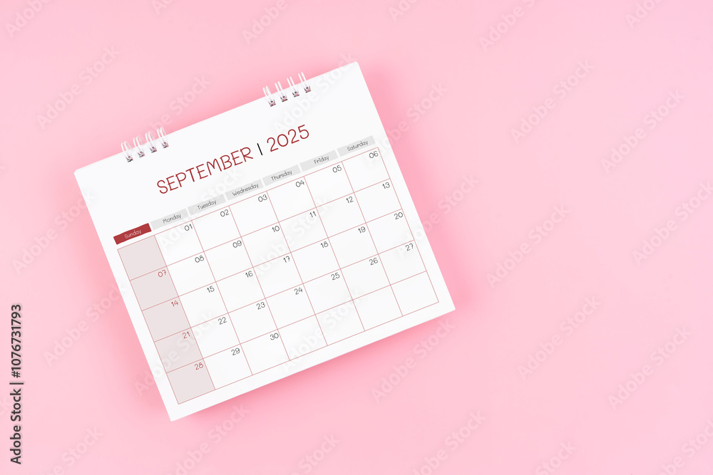 Top view on September desk calendar for 2025 year on pink background. Top view on September desk calendar for 2025 year on pink background.