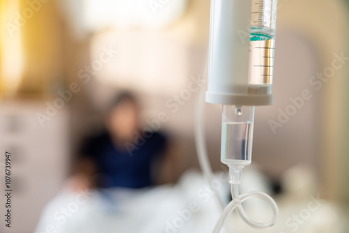 Принти на полотні A person is hooked up to a drip in a hospital room