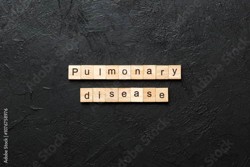 pulmonary disease word written on wood block. pulmonary disease text on table, concept photo