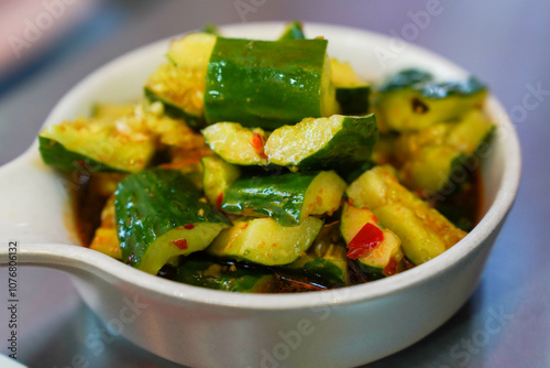 Obraz na płótnie Chinese smashed cucumber salad with chili peppers w salonie