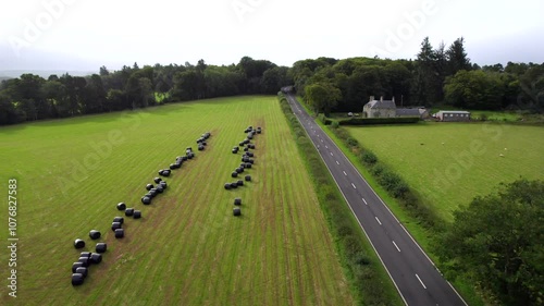 Running along a rainy Scottish main road by drone