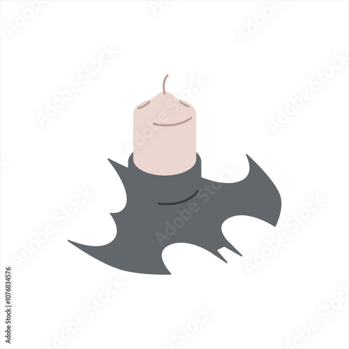 Candle in a candlestick in the shape of a bat