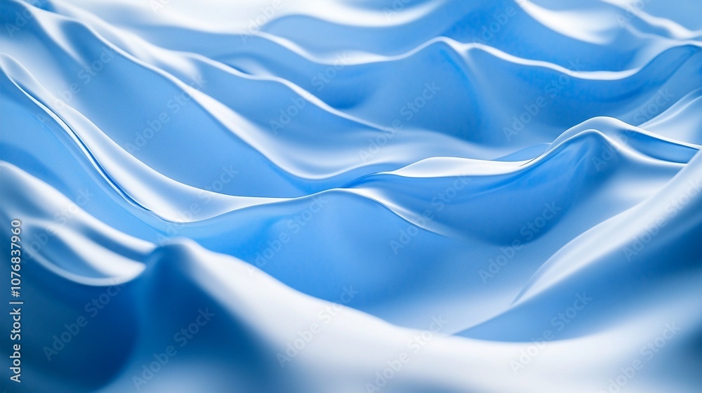 Fototapeta premium Smooth, undulating waves of silky blue fabric create a mesmerizing abstract landscape, evoking a sense of tranquility and fluid motion in this serene composition.