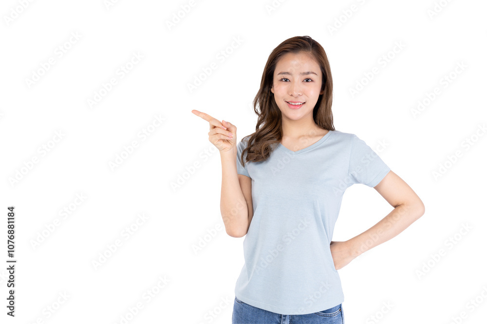 Smiling young woman pointing with her finger on a white background, showcasing enthusiasm and positivity. Smiling young woman pointing with her finger on a white background, showcasing enthusiasm and positivity.