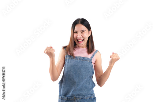 Фотография Excited young woman celebrating success with a joyful expression and raised fists against a white background