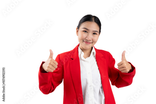 Smiling woman in a red blazer giving thumbs up, isolated on a white background. photo