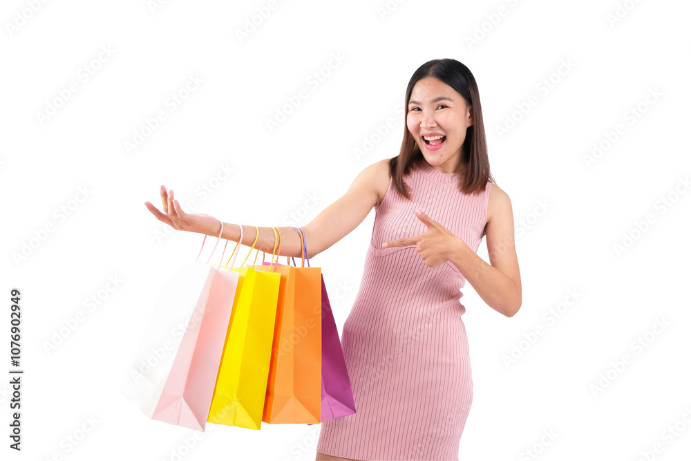 Young woman happily showcasing her shopping bags against a white background. Young woman happily showcasing her shopping bags against a white background.