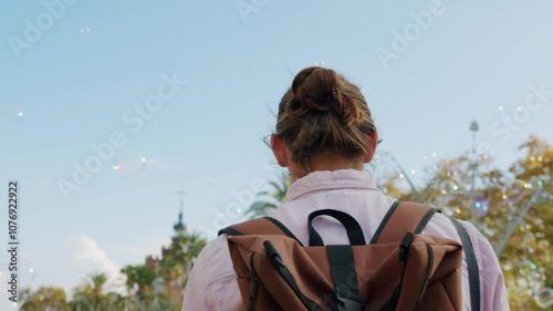 Happy tourist man in Barcelona, Spain. Vacation exploring interesting places to travel, student vacation, young man portrait walking in gothic square, old european city.  photo